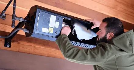 Alex installing an outdoor heater