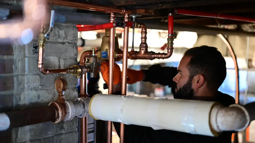 Alex fixing a pipe