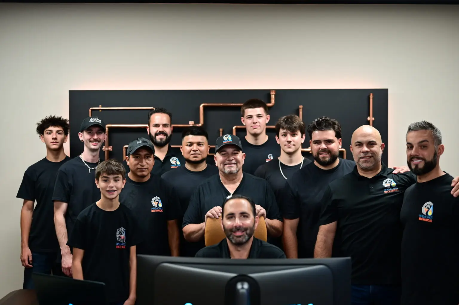Pipeworks Mechanical team gathered in the office